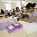 Bianca Acosta, 13, left, and Nallely Cortes, 12, both of Springdale, work on a three dimensional mod...
