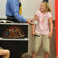 Myranda Head, 9, shrugs her shoulders Wednesday while telling magician Zac Barkowski she doesn’t hav...