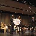 Fayetteville High School band director Barry Harper, from left, celebrates with Bill Schermerhorn an...
