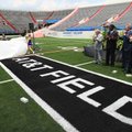 Cheerleaders from Mount St. Mary and Catholic High School uncover a logo Wednesday at War Memorial S...