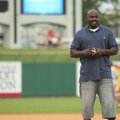 Former Arkansas Razorback Felix Jones throws out the Arkansas Travelers' ceremonial first pitch June...