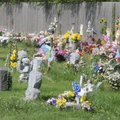 The lawn in a section of Bluff Cemetery in Springdale, shown Wednesday, is overgrown because numerou...