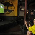 INTERNATIONAL INTEREST = Lori West of Fayetteville reacts to a near score Friday while watching Braz...