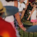 PARTY IN THE PARK - Lydia Handy, 7, of Bentonville, dances Friday as UltraSuede plays at Orchards Pa...