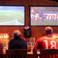 Fans watch two World Cup soccer matches Friday at Buffalo Wild Wings in Bentonville. On the left was...