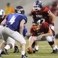 West center Allen Whitlow of Rogers Heritage prepares to snap the ball during the Arkansas High Scho...
