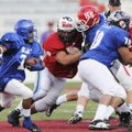 The West team’s Eric Pearce, middle, of Springdale Har-Ber breaks through the defense as the East’s ...