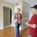 Megan Anthony, left, visits with Kerri Rachelle, property manager for Sycamore Apartments in Fayette...