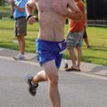  Rogers Heritage cross country coach Lee Wood finishes first in the Cancer Challenge 5K on Saturday ...