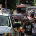 Will Phillips rides in the back of the lead truck as grand marshal of the Pride Parade Saturday June...