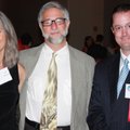 Single Parent Scholarship Fund of Northwest Arkansas board president Justin DeLille, from right, and...