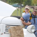 Darin Harryman and Colin Harryman, 2, look at an old truck Saturday during a car show at Ward Nail P...