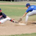 Fayetteville Lindsey’s Tyler Fourkiller, right, is late with the tag to Bartlesville, Okla., runner ...