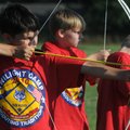 Chris Sanchez, 10, of Lowell, with Cub Scout Pack 166 shoots an arrow Wednesday during the Cub Scout...