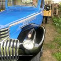Glenn Smith carefully backs his 1945 Chevrolet 2-ton dump bed truck into a garage for storage on Mon...