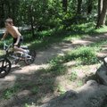 Seth Moore, 9, of Bentonville rides his bike Wednesday along a side trail running parallel to the Cr...
