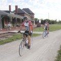 James Goodwin of Bella Vista and Janet Estes pass the restored Sedalia, Mo., train depot along the K...