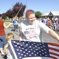 PATRIOTIC PARADE - Donna Johnson of Bentonville, a teacher at the Helen Walton Children’s Enrichment...