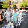 FIRST THURSDAY - Longtime local artist C.J. Kindy, left, speaks Thursday with artist Victor Parkerso...