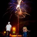 Ted and Shawn Morris of Bella Vista watch the Fourth Fest fireworks in 2007 at Memorial Park in Bent...