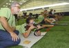 Shooting coach W.B. Merritt of Douglas, Ga., works Thursday with shooter Phaedra Vickers during practice at the Daisy BB Gun Championship Match.
