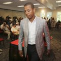 Georgia athletic director Damon Evans  leaves a news conference in Athens, Ga., Thursday, July 1, 20...