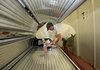 Shawn Peel, owner of Tansyou Tanning Center in Little Rock, cleans a tanning bed Thursday. Tanning salons nationwide are dealing with a new 10 percent tax, which started Thursday.