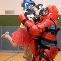  Lauren Zeeck, 7, delivers hammer fists and kicks Friday to “abductor” Sgt. Thomas See at the Walton...