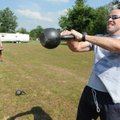  Andrew Woody, one of 11 recruits in the Rogers Basic Police Academy, swings a kettlebell Friday out...
