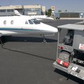  Carl Swedlund of Pinnacle Air Services refuels a jet Wednesday at the Springdale Municipal Airport....