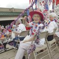 Ruth Ireland of Bella Vista rides a float and tosses candy to the crowd during the Bella Vista Patri...
