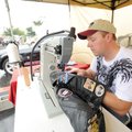 Jerry Rogers of Rogers sews a Bikes, Blues & BBQ patch to a customer’s leather vest Saturday while w...
