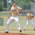  Bentonville’s Hayden Akins pitches to a Rogers batter Sunday during the 15-year-old division of the...