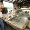 Ozark Military Museum volunteers Ted Mack, left, and Bob Kellett, both of Bella Vista, work Tuesday ...