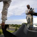 Clinton Rodriguez, right, and Eric Merida of Genesis Roofing apply a waterproof underlayment Tuesday...