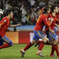  	Spain's Carles Puyol, second from right, celebrates after scoring a goal during the World Cup semi...