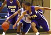 Arkansas Legends Chasen Williamson (right) takes the ball away from Middle Tennessee’s Adrian Scott (11) as the Legends’ Thomas Alexander looks on. Williamson had 18 points and seven steals as the Legends won 73-68 in overtime Wednesday at the AAU 15-and-under national tournament, which runs through Sunday at various sites in Pulaski County.