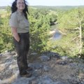 Natalie Casey, park interpreter at Withrow Springs State Park, pauses at an overlook along War Eagle...
