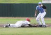Physicians’ Specialty Hospital’s Devin Bench receives the throw at first base as Vilonia’s Brad Thomas, left, slides back during Thursday’s game in Fayetteville.