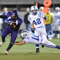 Fayetteville’s Demetrius Dean, left, avoids Rogers High’s Ben Cabell on his way to a 25-yard gain du...