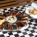 A full order of St. Louis-style ribs with cole slaw, Texas toast and an order of onion straws is a f...