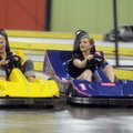Hayleigh Lewis, 15, left, races Ashley Horsley, 17, in go-karts during Teen Night at Fast Lane Enter...