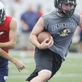 Bentonville’s Garrett Kaufman, right, scores a touchdown against Arkansas Baptist during the Southwe...