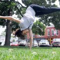 SQUARE PERSPECTIVE - Samantha Overstreet, 14, executes a round off Friday on the Bentonville Square....