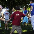 Tzofim Friendship Caravan scouts Idan Orlizkey, second right, and Tom Sabban dance with Maya Chappel...