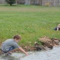 BOBBER PATROL -  Andrew Cherry, 4, left, watches Friday as Jackson Behar, 5, both of Springdale, tri...