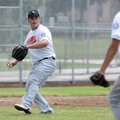 Luke Hulse of the Northwest Arkansas All-Stars, throws out a baserunner July 10 during the North Ark...
