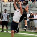 Bentonville’s Drew Edwards, right, disrupts a pass to Shiloh Christian’s Jon Hawes during the Southw...