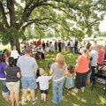 Members of the Phillips family gather to pray before eating in Prairie Grove.