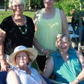 Botanical Garden of the Ozarks board member Chris Bell, back left, is joined July 1 by Mary Mann, cl...